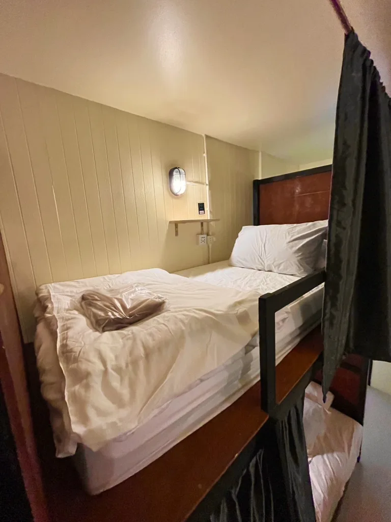 Image of the top bunks in the bedroom of The Cocoon Hostel - Koh Samet