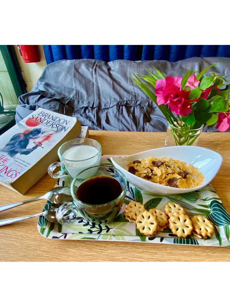 Cozy common area with free WiFi and book exchange at a comfortable Koh Samet hostel.
