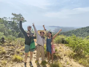 Guests from The Cocoon Hostel at the top of The Koh Samet Nature Trail viewpoint